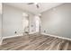 Spacious bedroom with wood look tile floors and ensuite bathroom access at 42424 N Gavilan Peak Pkwy # 24206, Anthem, AZ 85086