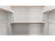 Walk in closet with built in shelving and wood rods at 42424 N Gavilan Peak Pkwy # 24206, Anthem, AZ 85086