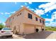 Exterior of two-story home with two car garage and white car parked in front at 42424 N Gavilan Peak Pkwy # 24206, Anthem, AZ 85086