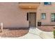 Inviting home entrance with landscaped walkway to the front door at 42424 N Gavilan Peak Pkwy # 24206, Anthem, AZ 85086