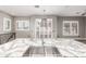 Bright kitchen with a gray and white countertop and stainless steel sink, neutral gray walls, and shuttered windows at 42424 N Gavilan Peak Pkwy # 24206, Anthem, AZ 85086
