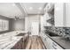 Open kitchen with granite island, stainless steel appliances, and sleek cabinetry at 42424 N Gavilan Peak Pkwy # 24206, Anthem, AZ 85086