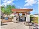 Outdoor lounge area with a grill, seating, and shaded pergola at 42424 N Gavilan Peak Pkwy # 24206, Anthem, AZ 85086