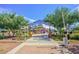 Community playground with splash pad and colorful play structures at 42424 N Gavilan Peak Pkwy # 24206, Anthem, AZ 85086