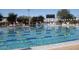 Community pool with swimming lanes, lounge chairs, and Anthem Community Center at 42424 N Gavilan Peak Pkwy # 24206, Anthem, AZ 85086