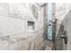 Modern shower with marble-look tile surround and stylish fixture at 42424 N Gavilan Peak Pkwy # 24206, Anthem, AZ 85086