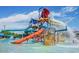 Community water park with water slides, splash pads, and blue skies at 42424 N Gavilan Peak Pkwy # 24206, Anthem, AZ 85086