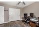 Bedroom with ceiling fan, hardwood floors and ample closet space at 43303 N 44Th Ave, New River, AZ 85087