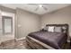 Bedroom with hardwood floors, ceiling fan and wood accent wall at 43303 N 44Th Ave, New River, AZ 85087