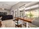 Bright dining area with stylish lighting, adjacent to a cozy living space at 43303 N 44Th Ave, New River, AZ 85087