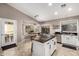 Spacious kitchen featuring a breakfast bar and a dining area with an abundance of natural light at 43303 N 44Th Ave, New River, AZ 85087