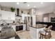 Well-equipped kitchen with stainless steel appliances and a functional center island at 43303 N 44Th Ave, New River, AZ 85087