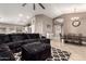 Inviting living room featuring a plush, oversized sectional sofa and open layout at 43303 N 44Th Ave, New River, AZ 85087