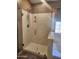 This bathroom features a glass shower with a shower head, a soap dish, and a sturdy handle at 43303 N 44Th Ave, New River, AZ 85087