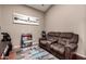 Cozy sitting room featuring comfortable reclining seating, a soft rug, and decor at 43303 N 44Th Ave, New River, AZ 85087