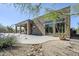 Charming backyard featuring a covered patio, gravel landscaping, and native desert vegetation, enhancing outdoor enjoyment at 4772 E Agave Ln, Cave Creek, AZ 85331