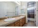 Bathroom with double vanity, lots of counter space, with shower in the background at 4772 E Agave Ln, Cave Creek, AZ 85331