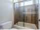Bathroom with decorative tile and glass shower door at 4772 E Agave Ln, Cave Creek, AZ 85331