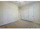 Neutral bedroom with closet, neutral carpeting, and doorway at 4772 E Agave Ln, Cave Creek, AZ 85331
