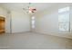 Spacious bedroom features recessed lighting, neutral carpet, and access to an ensuite bathroom at 4772 E Agave Ln, Cave Creek, AZ 85331