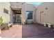 Desert-style home entrance with seating area and native landscaping features at 4772 E Agave Ln, Cave Creek, AZ 85331