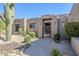 Charming desert-style home featuring a welcoming entrance and native landscaping at 4772 E Agave Ln, Cave Creek, AZ 85331