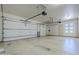 Spacious three car garage with white doors and ample natural light at 4772 E Agave Ln, Cave Creek, AZ 85331
