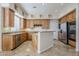 Bright kitchen featuring stainless steel appliances, granite countertops and custom cabinets at 4772 E Agave Ln, Cave Creek, AZ 85331