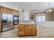 Open-concept kitchen includes stainless steel appliances, granite countertops, and center island at 4772 E Agave Ln, Cave Creek, AZ 85331