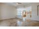 Open living area with a view of the kitchen with breakfast bar, bright windows, and tile floors at 4772 E Agave Ln, Cave Creek, AZ 85331