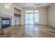 Spacious living area with a fireplace, bright windows, and tile floors. The perfect gathering space at 4772 E Agave Ln, Cave Creek, AZ 85331