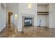 Focal point is the elegant fireplace, complemented by tasteful wall decor and modern lighting at 4772 E Agave Ln, Cave Creek, AZ 85331