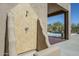 Stone tiled outdoor shower adjacent to pool and covered patio; luxury living at 4772 E Agave Ln, Cave Creek, AZ 85331