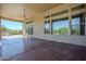 Expansive covered patio with ceiling fan, offering seamless indoor-outdoor living with pool views at 4772 E Agave Ln, Cave Creek, AZ 85331