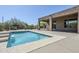 Outdoor pool with surrounding desert landscaping and a covered patio with modern architecture at 4772 E Agave Ln, Cave Creek, AZ 85331