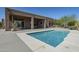A clear blue pool with desert landscape and architecture featuring a covered patio at 4772 E Agave Ln, Cave Creek, AZ 85331