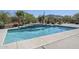 Beautiful pool with stone trim and cascading waterfall feature against desert landscaping and mountain views at 4772 E Agave Ln, Cave Creek, AZ 85331
