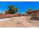 Spacious backyard featuring mature trees and desert landscaping on a sunny day at 5237 W Mountain View Rd, Glendale, AZ 85302