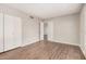 Neutral bedroom with a closet and wood-look flooring at 5237 W Mountain View Rd, Glendale, AZ 85302