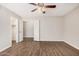 Neutral bedroom features a ceiling fan, and wood-look flooring at 5237 W Mountain View Rd, Glendale, AZ 85302