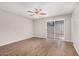 Neutral bedroom features a ceiling fan, and wood-look flooring at 5237 W Mountain View Rd, Glendale, AZ 85302