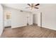 Spacious bedroom with an ensuite bathroom, large closet and wood-look flooring at 5237 W Mountain View Rd, Glendale, AZ 85302