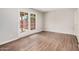 Bedroom features a door to the backyard and wood-look flooring at 5237 W Mountain View Rd, Glendale, AZ 85302
