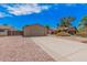 Single-story home with a two-car garage and xeriscaped front yard at 5237 W Mountain View Rd, Glendale, AZ 85302