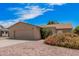 Cozy single-story home showcasing a two-car garage and mature landscaping at 5237 W Mountain View Rd, Glendale, AZ 85302
