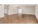 Bright living room with neutral walls, modern flooring, and access to the outdoors at 5237 W Mountain View Rd, Glendale, AZ 85302