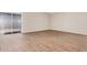 Cozy living room with modern flooring, neutral walls, and sliding glass doors at 5237 W Mountain View Rd, Glendale, AZ 85302