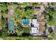 Aerial shot of a home with a basketball court, pool, well-manicured landscaping, and tile roof at 6648 E Horseshoe Rd, Paradise Valley, AZ 85253