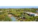 Expansive aerial view of the estate showcasing the pool, sport court, and mature tree coverage at 6648 E Horseshoe Rd, Paradise Valley, AZ 85253