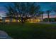 Expansive backyard featuring a pool, manicured lawn, and covered patio, perfect for outdoor living at 6648 E Horseshoe Rd, Paradise Valley, AZ 85253